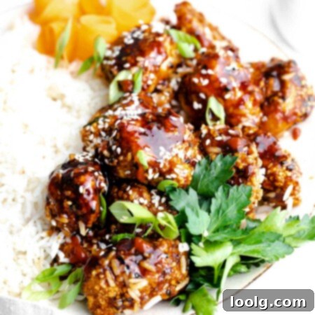 Crispy Air Fryer Teriyaki Chicken 11 air fryer teriyaki chicken on plate with green onions and rice