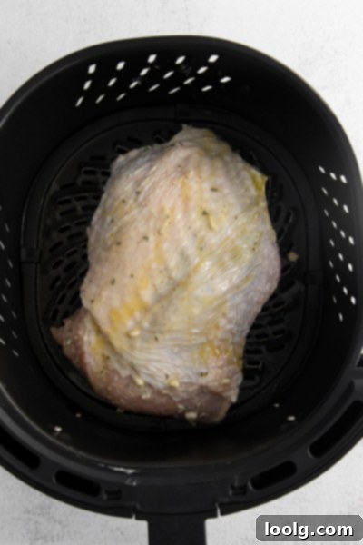 Perfect Air Fryer Turkey Breast 4 Air Fryer Turkey Breast cooking in the air fryer