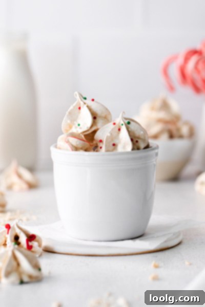 Frost Kissed Mint Puffs 27 Light and airy peppermint meringues with subtle red swirls, artfully piped and ready for the holidays.