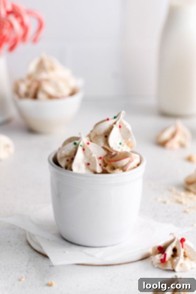 Frost Kissed Mint Puffs 9 A collection of holiday desserts, including a variety of cookies and barks, ready for serving.