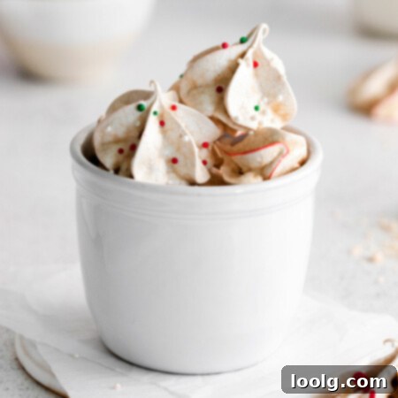 Frost Kissed Mint Puffs 10 A cup full of light and airy peppermint meringues, speckled with red and green, ready to be enjoyed.