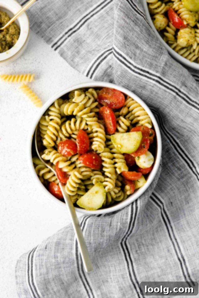 Refreshing Summer Pesto Pasta Salad 6 bowl of summer pesto pasta salad on a grey napkin