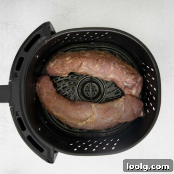 Perfect Air Fryer Pork Tenderloin 3 Sliced Air Fryer Pork Tenderloin with fresh rosemary