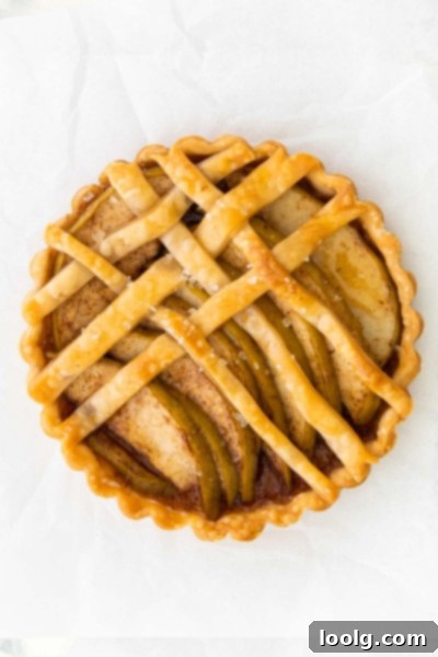 Bite-Sized Apple Tartlets 5 Several mini apple tarts arranged on a serving plate, ready to be enjoyed.