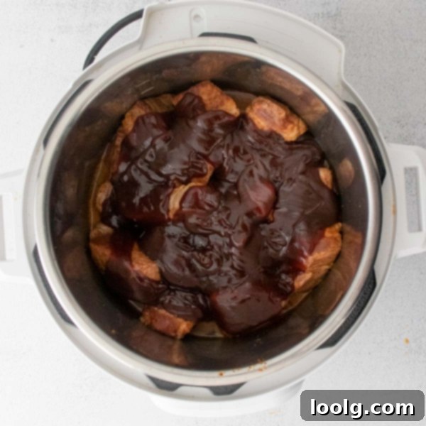Fall-Apart Instant Pot Pork Shoulder 5 image of an instant pot pork shoulder in a microwave safe dish