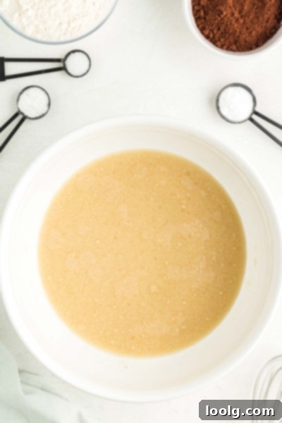 Mixing wet ingredients for Frankenstein cupcakes