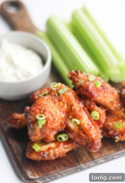 Baked or Air Fried Honey Garlic Wings 9 Air fryer basket filled with crispy, golden chicken wings, perfectly cooked and ready for sauce