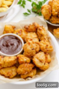 Your Air Fryer Game Day Playbook 3 Dipping sauce next to crispy air fryer popcorn chicken