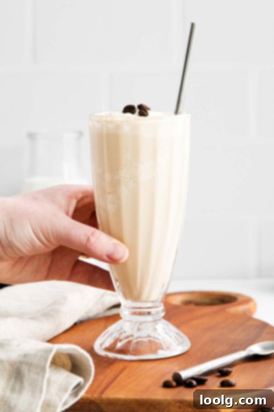 Velvet Mocha Shake 4 Another view of the mocha milkshake, showing its creamy texture and rich color, with a light chocolate drizzle.