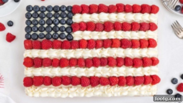 A Slice of Liberty 2 Independence Day Cake with blueberries and raspberries forming a flag