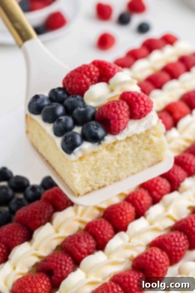 A Slice of Liberty 3 Independence Day Cake with a slice cut out, showing the flag design