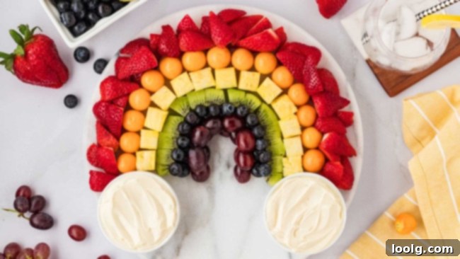 Kaleidoscope of Fruit 9 A small bowl of the creamy fruit dip, garnished lightly, placed on a wooden surface.