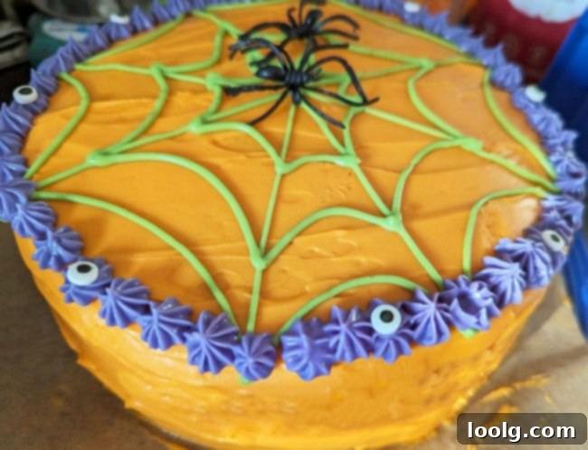 Enchanted Ghost Cake 15 A bowl of vibrant purple cream cheese frosting.