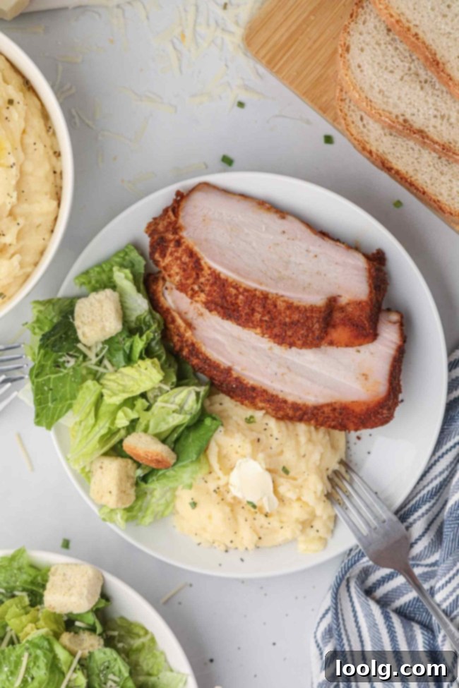 Artisan Smoked Turkey Breast 4 A perfectly smoked turkey breast, golden brown and glistening, with visible smoke rings.