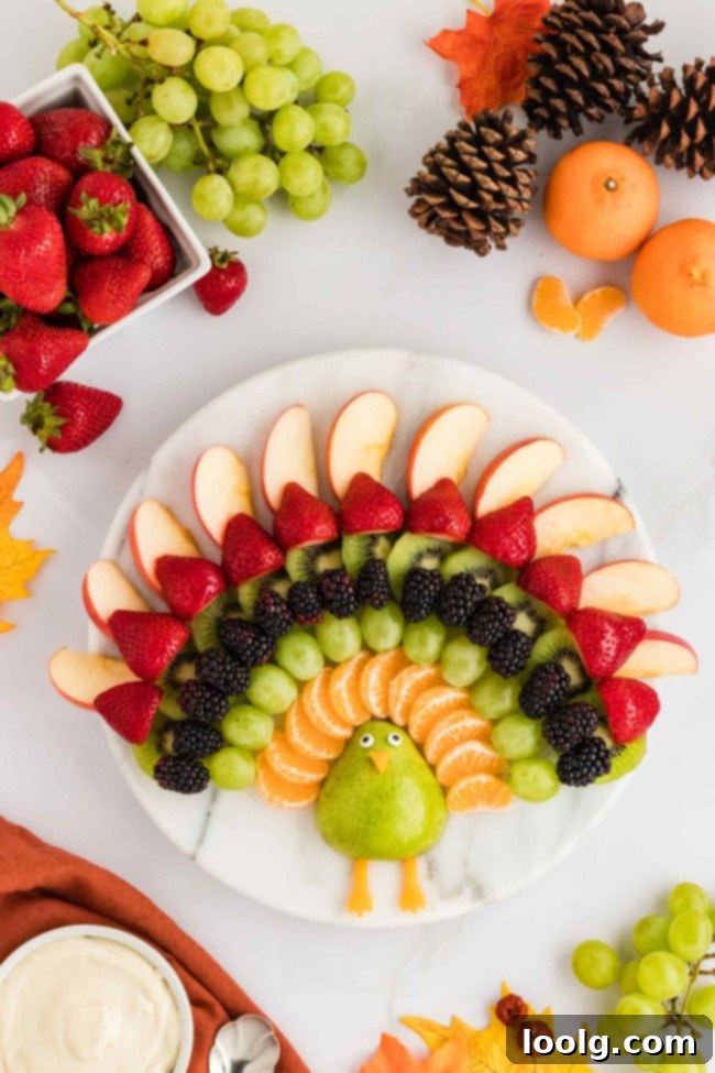 Thanksgiving's Festive Fruit Turkey 2 fruit turkey centerpiece on a white lazy susan