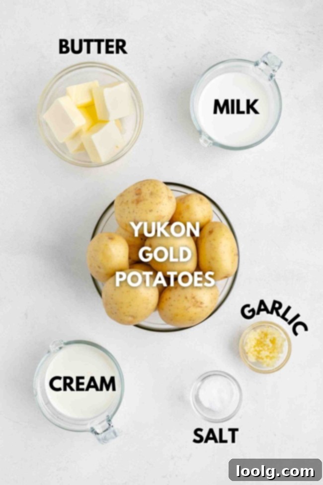 Golden Velvety Yukon Gold Mash 3 Close-up of the ingredients for Yukon Gold mashed potatoes, including potatoes, milk, cream, butter, and garlic.