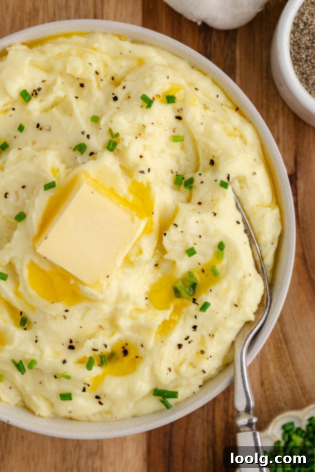 Golden Velvety Yukon Gold Mash 9 A spread of various dishes including mashed potatoes, possibly part of a holiday meal.