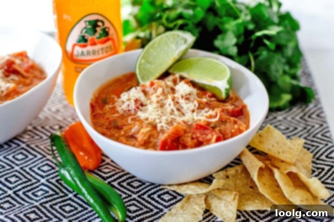 Qdoba's Signature Tortilla Soup 2 Overhead shot of a bowl of Qdoba Tortilla Soup with cheese and lime