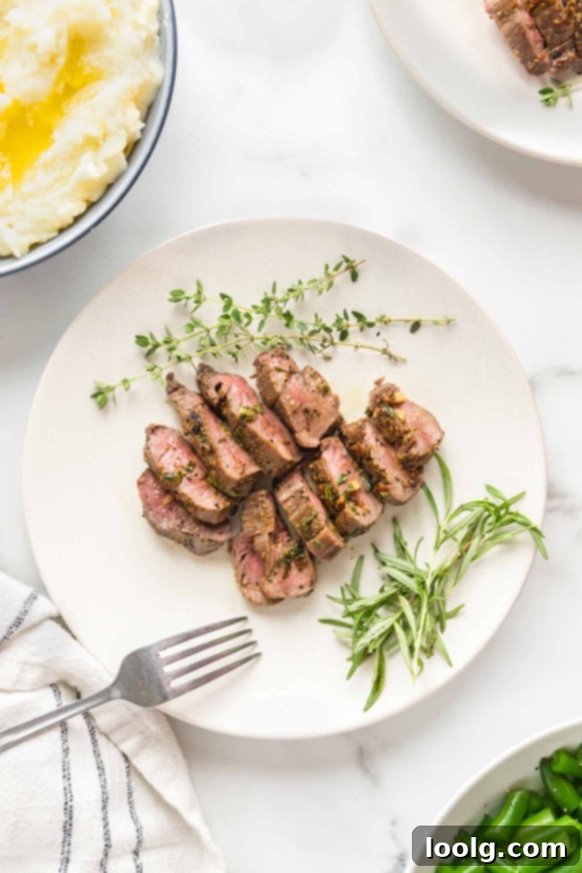 Wild Venison Tenderloin 4 Raw venison tenderloin on a cutting board, seasoned and ready for cooking