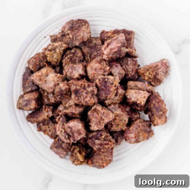 Hearty Venison Stew 9 Step 4: Removing browned venison to a plate.
