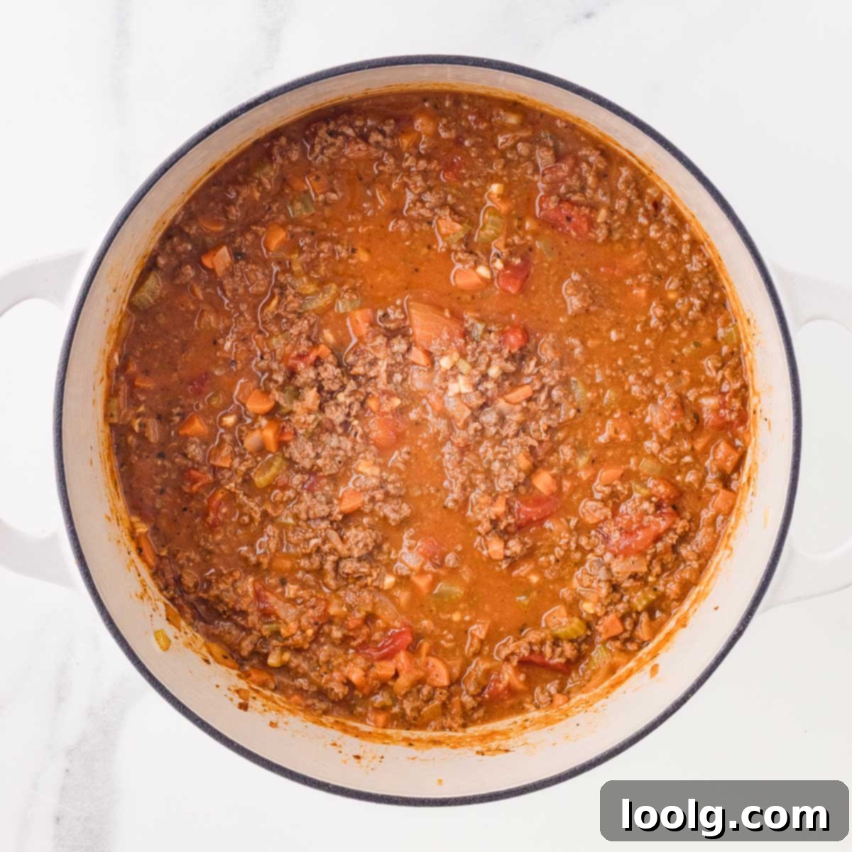Slow-Simmered Venison Bolognese 12 finished venison bolognese in white dutch oven