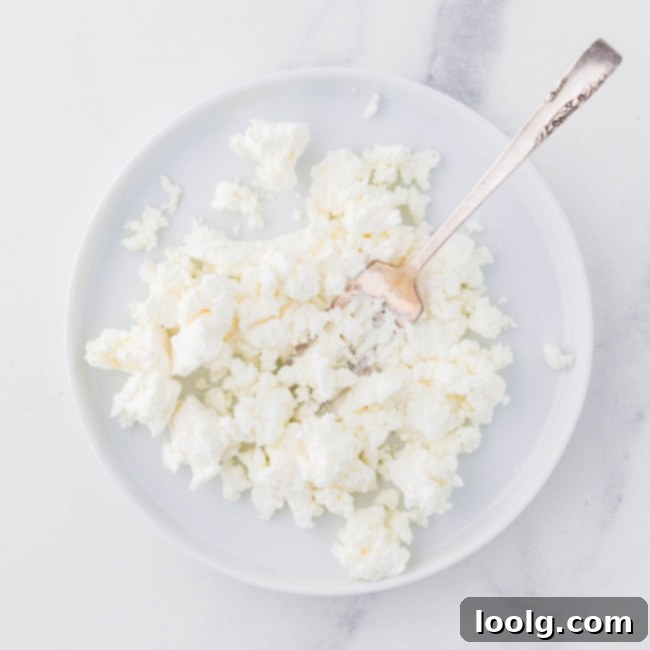 Artisan Goat Cheese Salad 7 crumbling goat cheese in a bowl