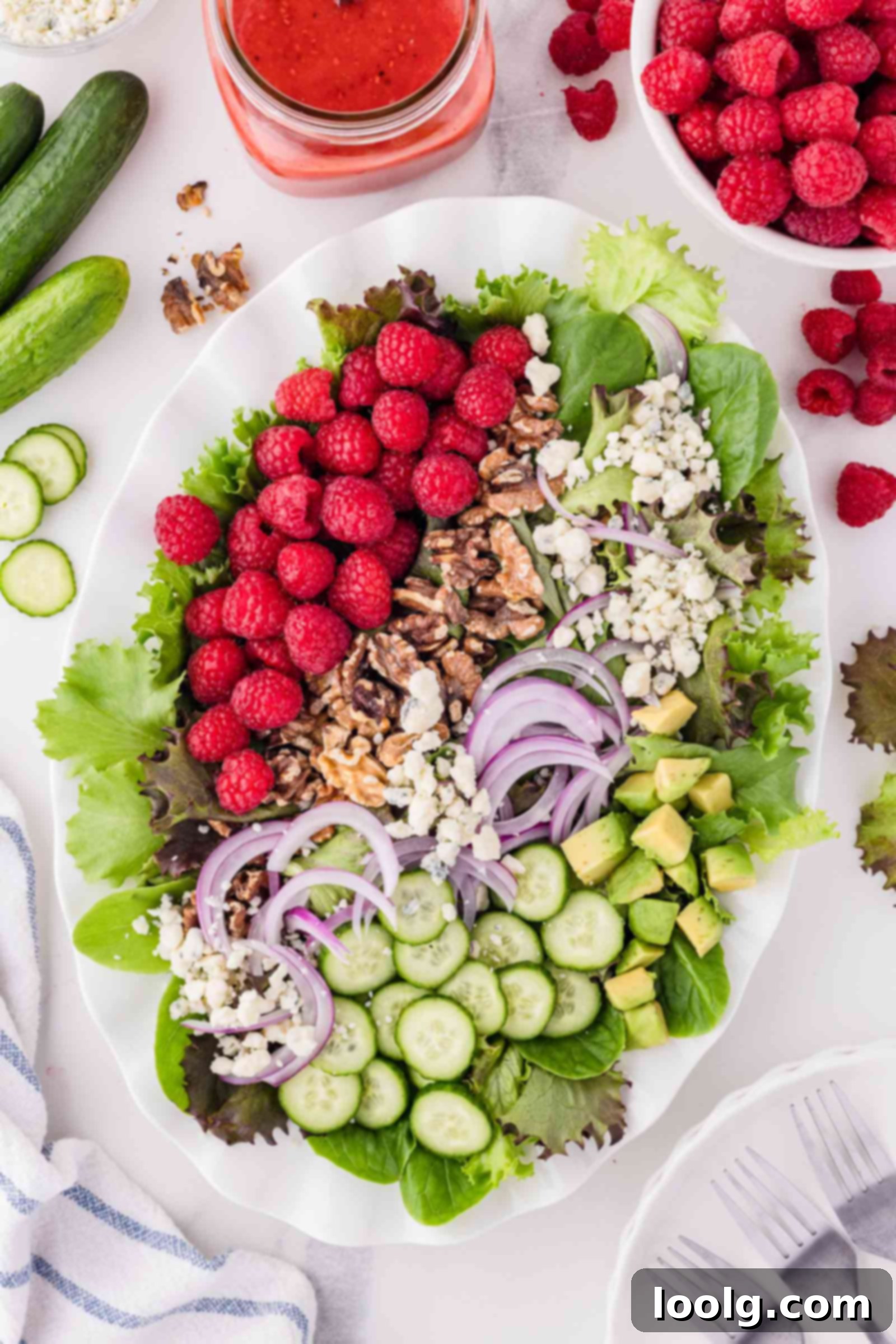 Refreshing Raspberry Salad 3 raspberry salad on a white serving platter