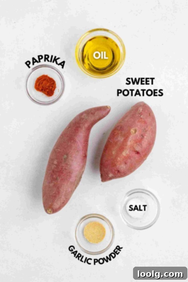 Golden Crispy Fried Sweet Potatoes 3 Two whole sweet potatoes are surrounded by small bowls of oil, paprika, salt, and garlic powder, each labeled with text naming the ingredient. The items are arranged on a white background.