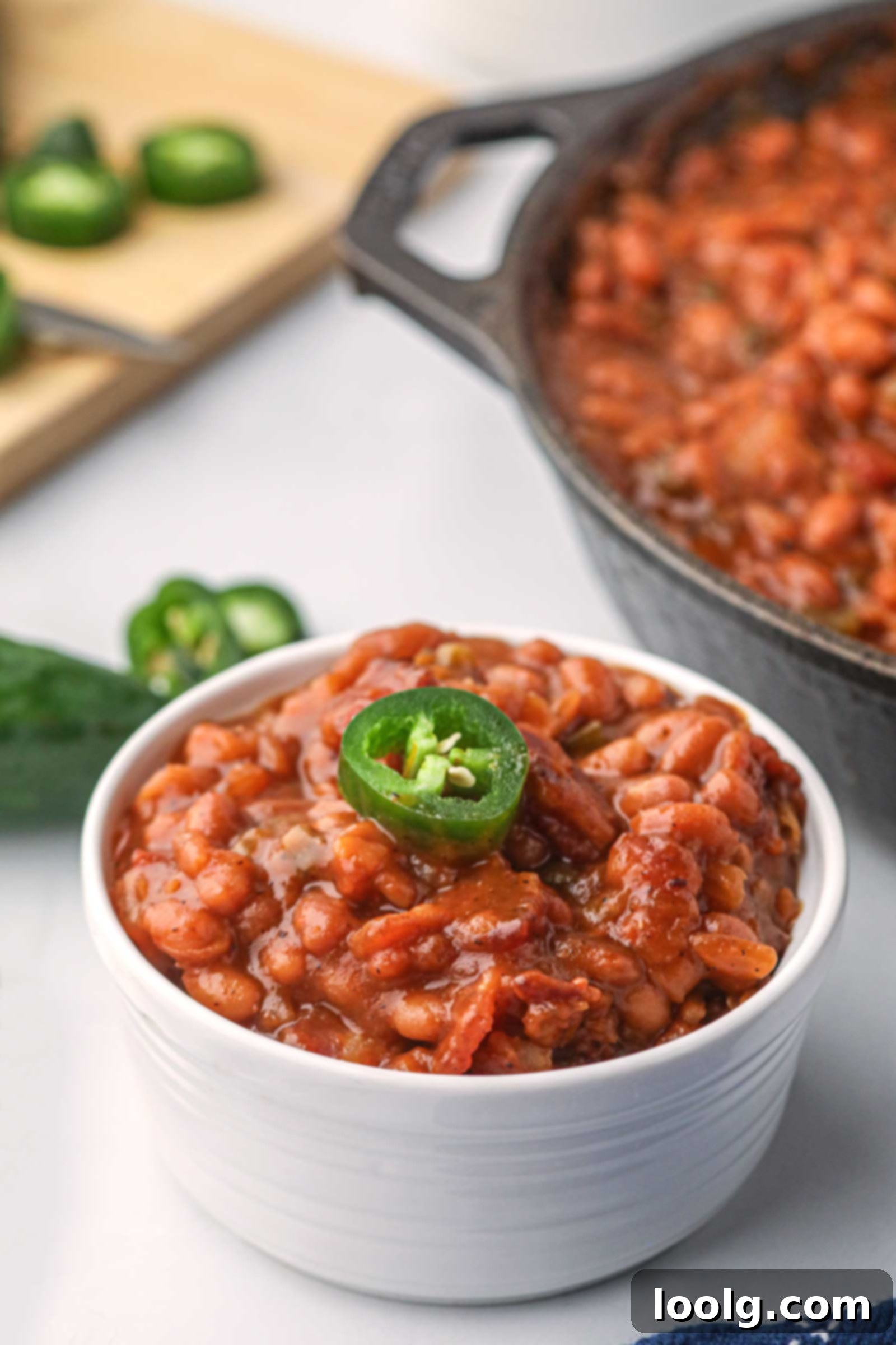 Slow-Smoked Baked Beans 6 small white bowl filled with smoked baked beans