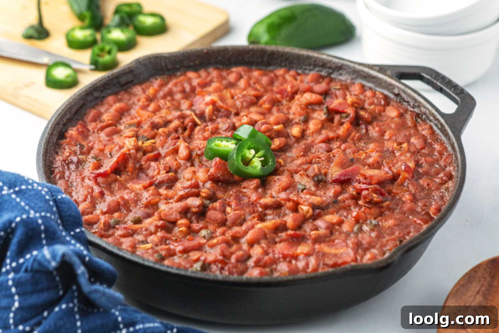 Slow-Smoked Baked Beans 8 close-up of smoked baked beans in a large cast iron skillet
