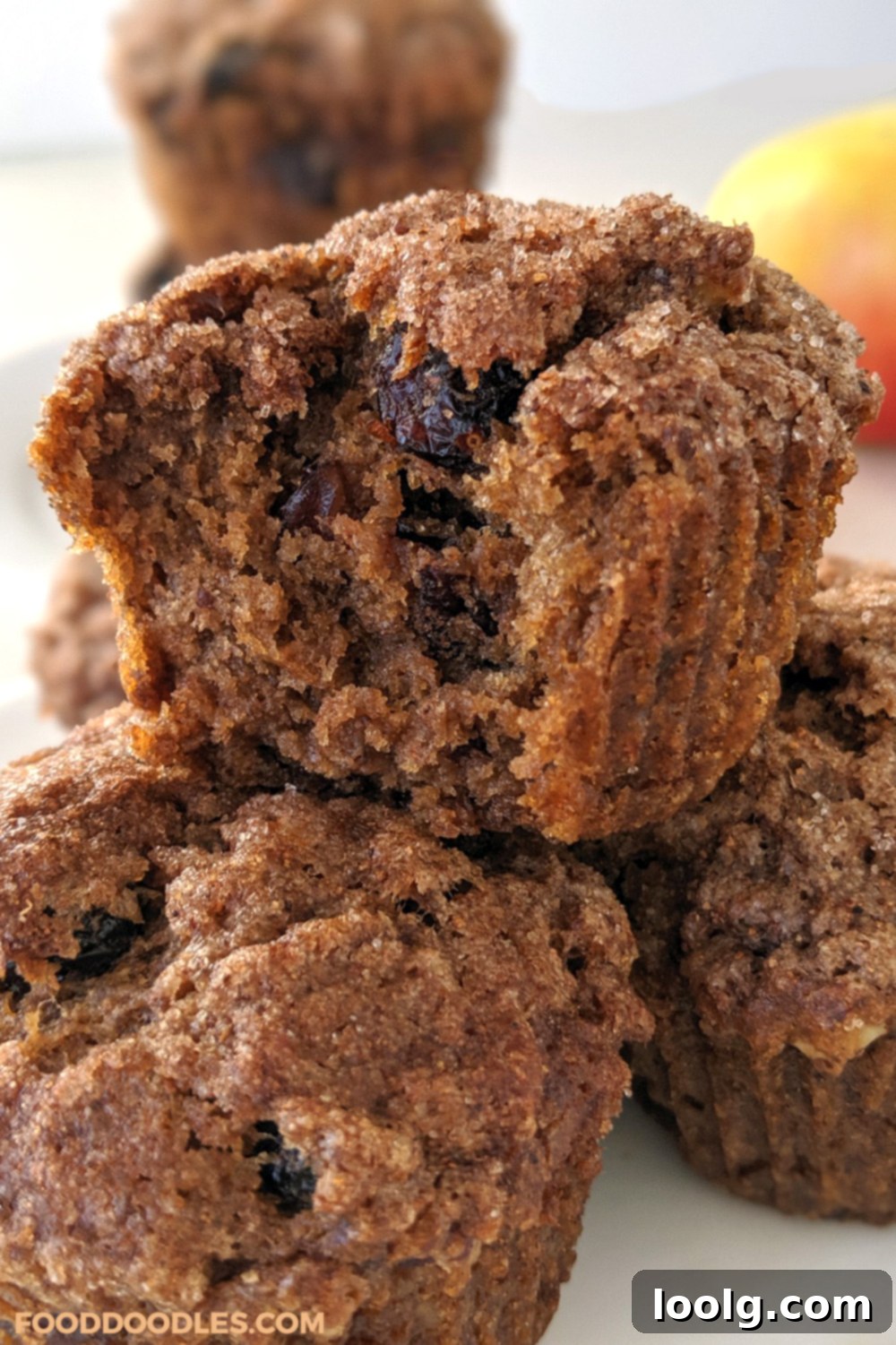 Wholesome Applesauce Muffins 3 Close-up of a stack of healthy applesauce muffins, showing their fluffy texture and delicious add-ins.