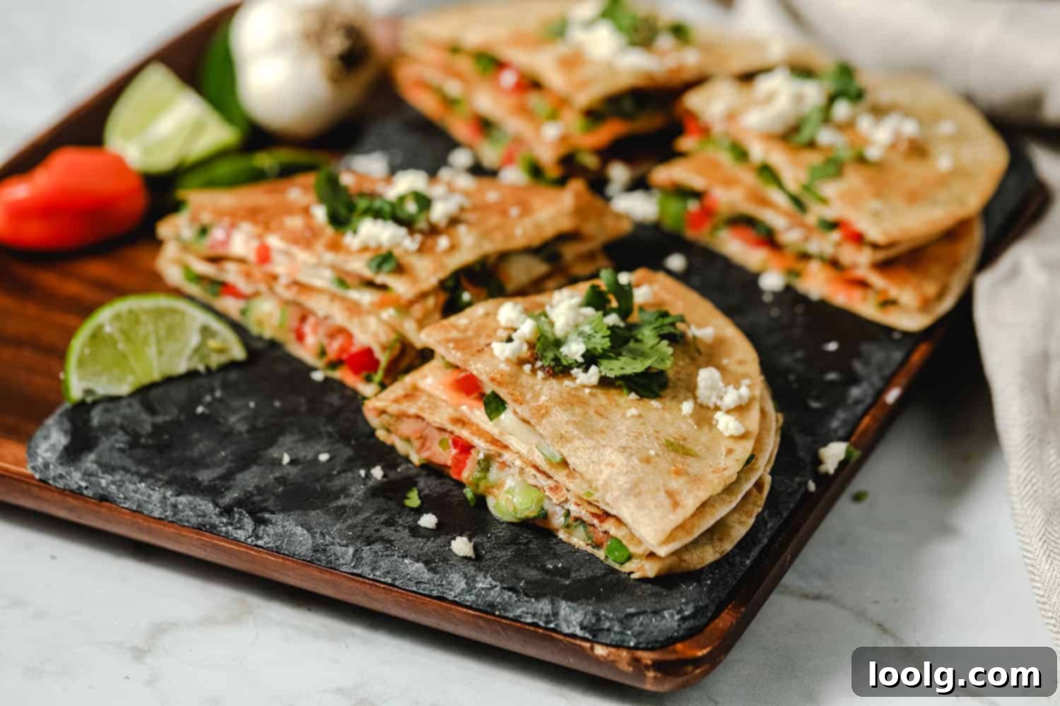 Effortless Plant-Based Quesadillas 4 A close-up shot of finely chopped fresh vegetables, including carrots, bell peppers, onions, and spinach, prepared for vegetarian quesadillas.