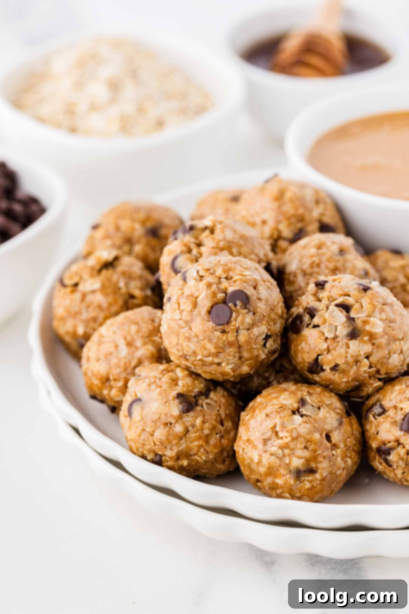 No-Bake Peanut Butter Oatmeal Energy Bites 2 white plate filled with oatmeal peanut butter balls