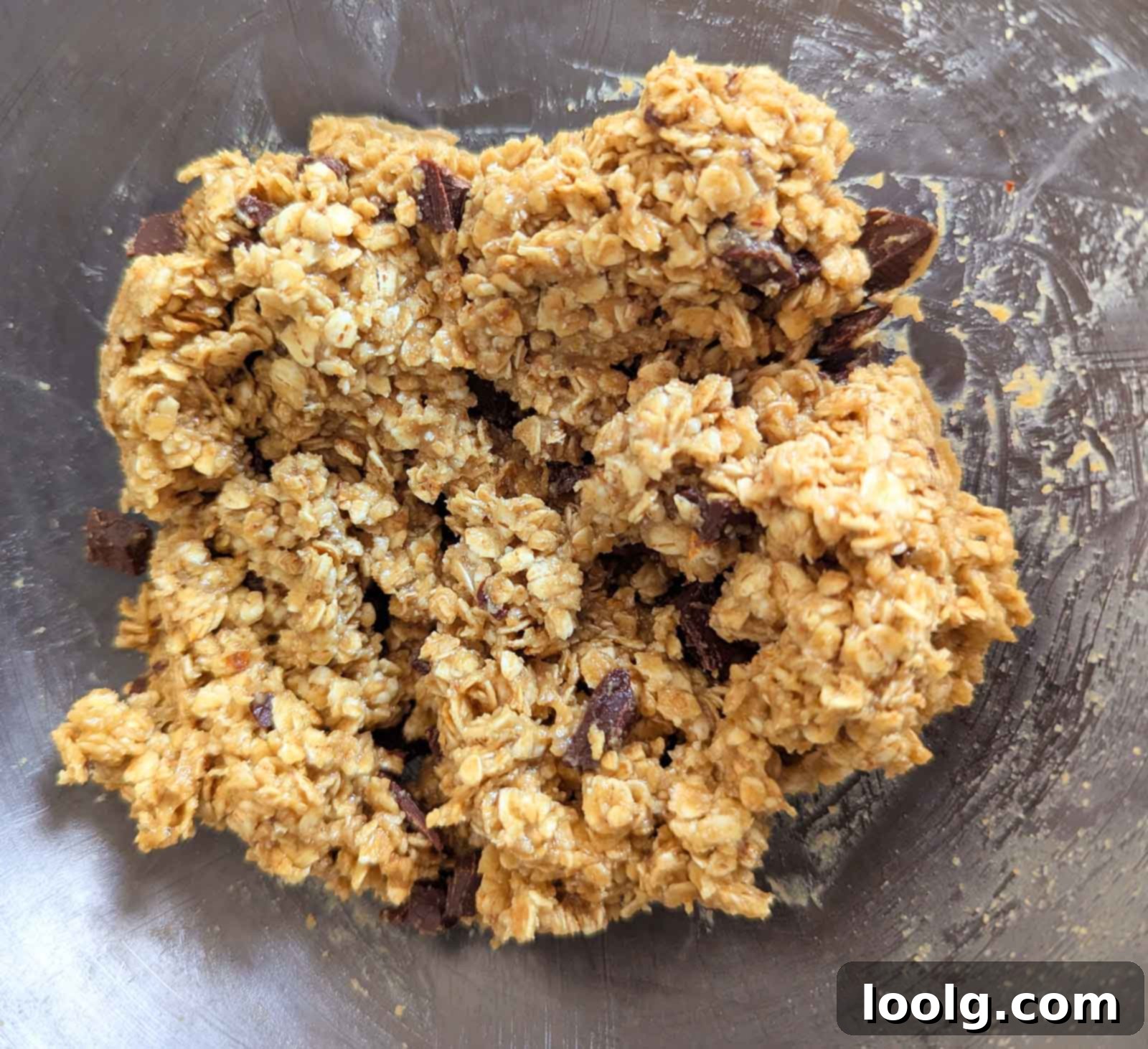 No-Bake Peanut Butter Oatmeal Energy Bites 5 the peanut butter oatmeal mixture mixed together in a glass bowl