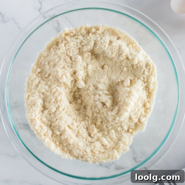 Almond Amore Bites 4 Dry ingredients (almond flour, granulated sugar, salt) mixed together in a clear mixing bowl