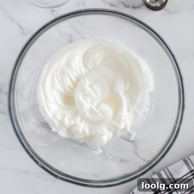 Almond Amore Bites 5 Bowl of fluffy whipped egg whites, showing soft peaks
