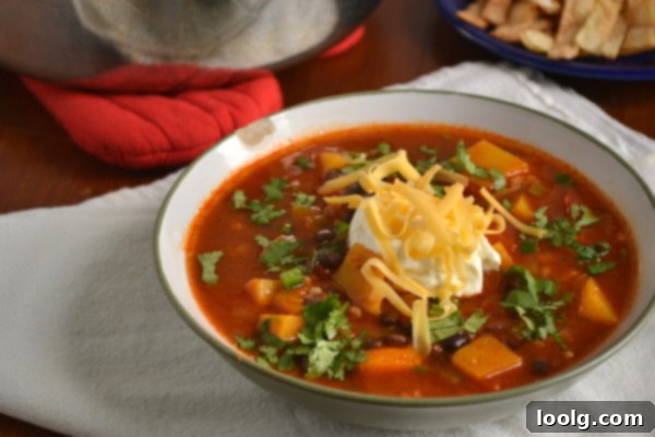 Fiesta Butternut and Black Bean Soup 10 A large pot brimming with hearty Butternut Squash and Black Bean Taco Soup, ready to be served