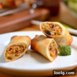 Spicy Crunch Baked Broccoli Spring Rolls 1 Crispy Baked Broccoli Sriracha Spring Rolls in a bowl with dipping sauce
