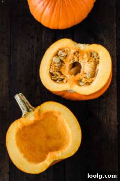 Crafting Homemade Pumpkin Puree 4 Pumpkin halves with seeds scooped out, ready for roasting