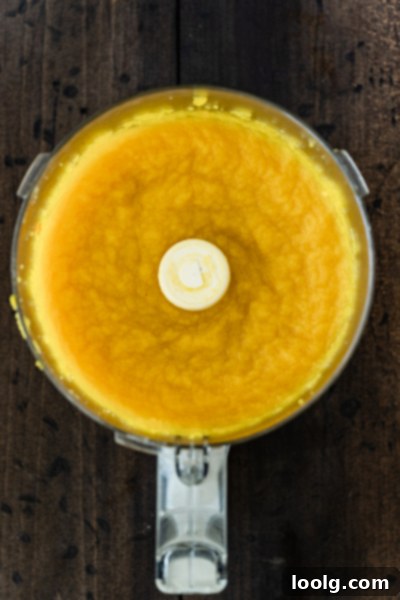 Crafting Homemade Pumpkin Puree 8 Smooth pumpkin puree in a food processor, ready for draining