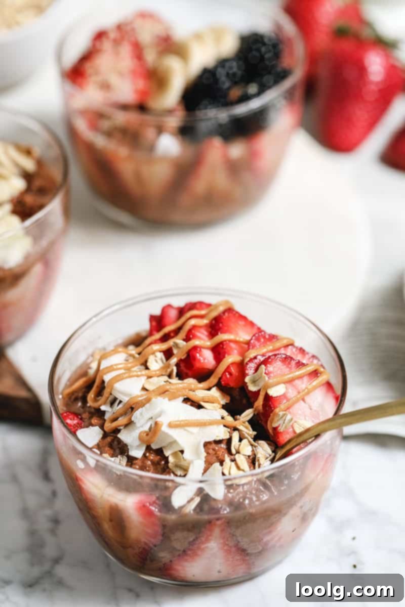 Indulgent Chocolate Overnight Oats 5 A trio of chocolate overnight oats jars with various toppings for breakfast prep