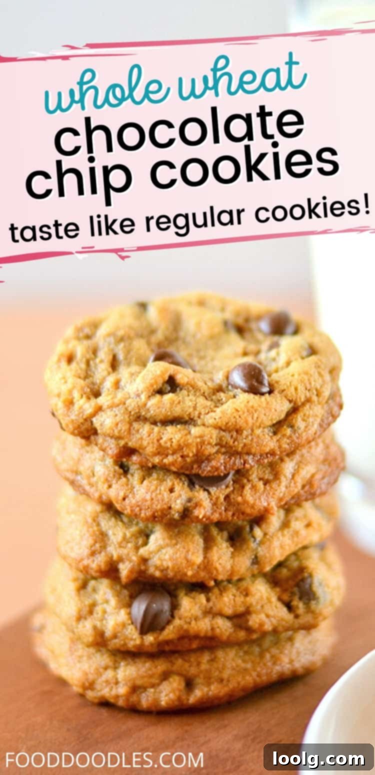 Perfectly Thick and Chewy 100% Whole Wheat Chocolate Chip Cookies 2 Stacked Thick and Chewy Whole Wheat Chocolate Chip Cookies with a glass of milk
