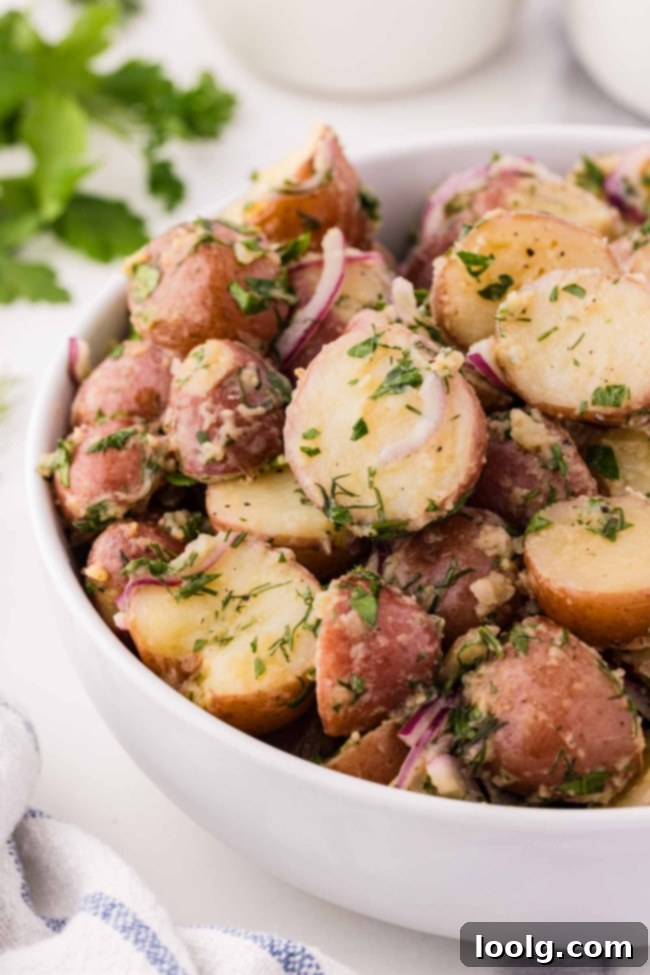 no mayo potato salad in a white bowl on a white table