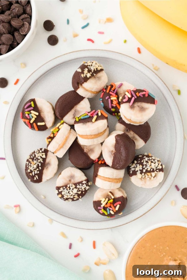 Peanut Butter Banana Bites: No-Bake Frozen Snack 2 white plate filled with peanut butter bananas on a white table