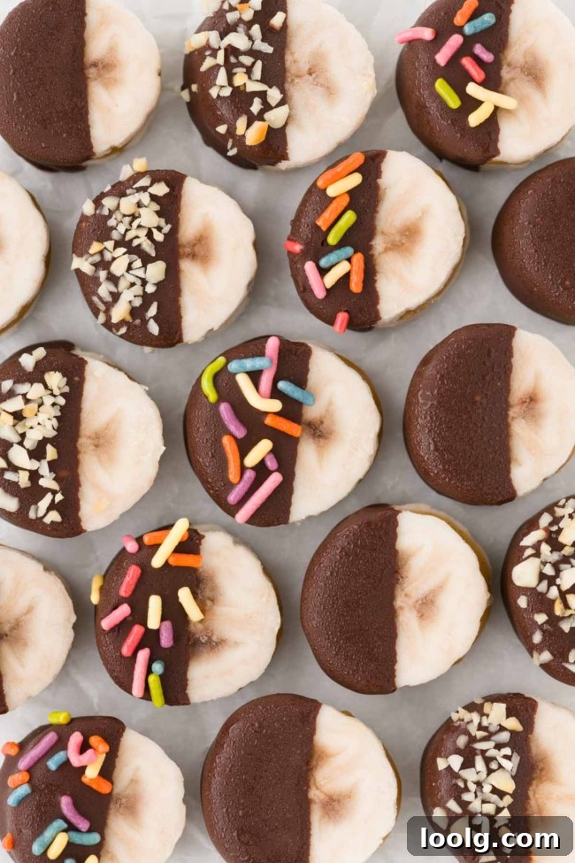 Peanut Butter Banana Bites: No-Bake Frozen Snack 6 peanut butter bananas lined up on parchment paper
