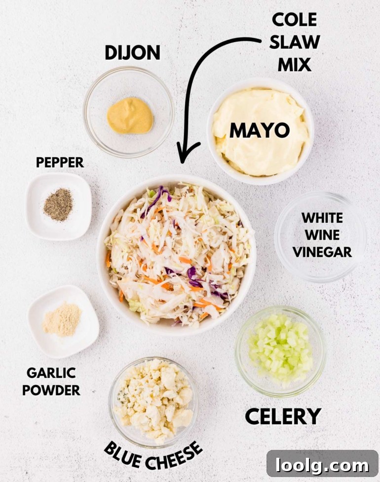 Creamy Blue Cheese Coleslaw with Tangy Dressing 3 ingredients needed to make blue cheese slaw on a white table