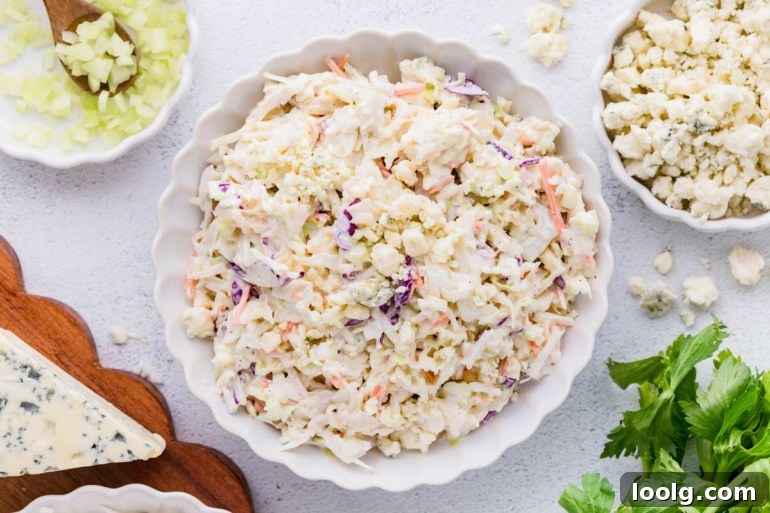 Creamy Blue Cheese Coleslaw with Tangy Dressing 5 overhead shot of blue cheese coleslaw in a white bowl on a white table
