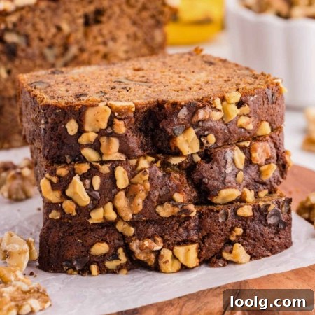 wheat banana nut bread slices on parchment paper