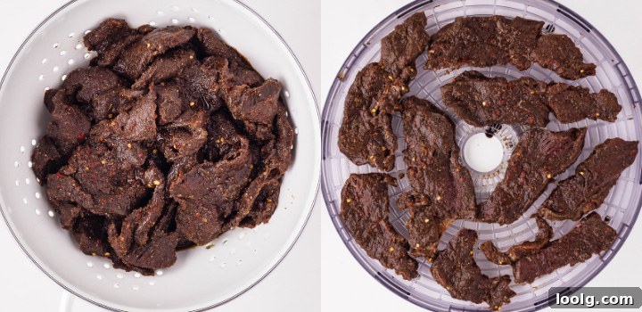 Homemade Smoky Venison Jerky Recipe 7 Marinated venison strips draining in a colander and arranged on dehydrator trays before drying.